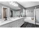 Bathroom features double sinks, soaking tub, walk-in shower, and gray paint at 3775 Balderas St, Brighton, CO 80601