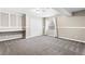 Cozy bedroom with plush carpeting and custom built-in shelving at 3775 Balderas St, Brighton, CO 80601
