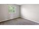 Bedroom with neutral walls and carpet with a window for natural light at 3775 Balderas St, Brighton, CO 80601