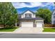 Charming two-story home with a stone accent, three-car garage and well-manicured lawn at 3775 Balderas St, Brighton, CO 80601