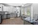Bright kitchen featuring stainless steel appliances, granite countertops, and adjacent breakfast nook at 3775 Balderas St, Brighton, CO 80601