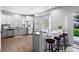 Bright kitchen featuring stainless steel appliances, granite countertops, and a breakfast bar at 3775 Balderas St, Brighton, CO 80601