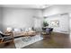 Open concept living room and dining room area is bright with updated furniture and wall decor at 3775 Balderas St, Brighton, CO 80601