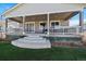 Back patio with steps down to the yard and outdoor seating area, perfect for entertaining at 5611 Saddle Skirt St, Parker, CO 80134