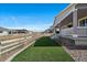 Spacious backyard with manicured lawn, privacy fence and a covered patio at 5611 Saddle Skirt St, Parker, CO 80134