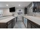 Finished basement wet bar with counter seating, storage cabinets, and beverage refrigerators at 5611 Saddle Skirt St, Parker, CO 80134