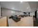 Finished basement with a pool table, a poker table, a bar and a large sectional sofa at 5611 Saddle Skirt St, Parker, CO 80134