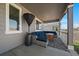 Cozy covered patio with comfortable outdoor seating, area rug and views of the fenced yard at 5611 Saddle Skirt St, Parker, CO 80134
