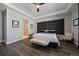 A spacious main bedroom features a modern en suite bathroom, stylish furniture, and ample natural light at 5611 Saddle Skirt St, Parker, CO 80134