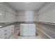 Walk-in closet provides ample storage space with custom shelving and drawers at 5611 Saddle Skirt St, Parker, CO 80134