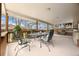 Inviting covered patio featuring comfortable seating, an outdoor grill, and serene backyard views at 2160 S Flower St, Lakewood, CO 80227
