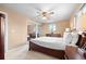 Spacious carpeted bedroom featuring a ceiling fan and sliding closet doors at 2160 S Flower St, Lakewood, CO 80227