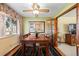Bright dining room with hardwood floors, a ceiling fan, and french doors leading to another room at 2160 S Flower St, Lakewood, CO 80227