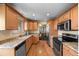 Bright kitchen features hardwood floors, light-colored countertops, and stainless steel appliances at 2160 S Flower St, Lakewood, CO 80227