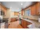 Spacious kitchen featuring hardwood floors, light-colored countertops, and a stainless steel dishwasher at 2160 S Flower St, Lakewood, CO 80227