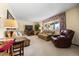 Bright living room with comfortable seating, a large window, and tasteful decor, creating an inviting space at 2160 S Flower St, Lakewood, CO 80227