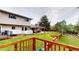 The backyard features a deck, trees, a lawn and patio at 6278 E Euclid Ave, Centennial, CO 80111