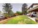 Backyard featuring a slide, a deck, a lawn, mature trees and patio at 6278 E Euclid Ave, Centennial, CO 80111