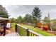 A backyard featuring a deck and a playground with slide at 6278 E Euclid Ave, Centennial, CO 80111