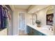 Bright bathroom with dual sinks, walk-in shower, and walk-in closet with ample storage space at 6278 E Euclid Ave, Centennial, CO 80111