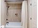 Elegant bathroom featuring a tub with shower and sleek bronze fixtures at 6278 E Euclid Ave, Centennial, CO 80111