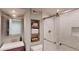 Updated bathroom featuring a glass shower with a rain shower head and custom tile work at 6278 E Euclid Ave, Centennial, CO 80111