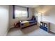 Cozy bedroom featuring a comfy bed, bedside table, and a window with natural light at 6278 E Euclid Ave, Centennial, CO 80111