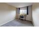 Comfortable bedroom with neutral walls, a desk, and a bright window at 6278 E Euclid Ave, Centennial, CO 80111