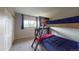 Spacious bedroom featuring a wooden bunk bed with lots of natural light at 6278 E Euclid Ave, Centennial, CO 80111