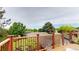 Enjoy panoramic views of the neighborhood trees from this relaxing wood deck at 6278 E Euclid Ave, Centennial, CO 80111