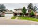 Charming two-story home with a well-manicured lawn, attached garage, and inviting curb appeal at 6278 E Euclid Ave, Centennial, CO 80111