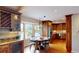 Well-lit eat-in kitchen featuring wood cabinets, stainless steel appliances, and a bay window at 6278 E Euclid Ave, Centennial, CO 80111
