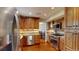 Updated kitchen featuring stainless steel appliances and wood cabinets, with breakfast table at 6278 E Euclid Ave, Centennial, CO 80111