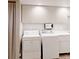 Functional laundry room featuring appliances, cabinetry, and ample counter space at 6278 E Euclid Ave, Centennial, CO 80111