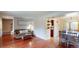 Open-concept living area featuring hardwood floors, comfortable seating, and easy access to the dining area at 6278 E Euclid Ave, Centennial, CO 80111