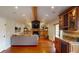 Open living room with fireplace and hardwood floors, connecting to the kitchen at 6278 E Euclid Ave, Centennial, CO 80111