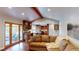 Open living room with access to the outdoors and a view of the kitchen at 6278 E Euclid Ave, Centennial, CO 80111