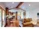 Bright living room with wood floors that lead to the kitchen and dining area at 6278 E Euclid Ave, Centennial, CO 80111