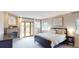 Serene primary bedroom with a fireplace, private balcony, and ample natural light at 6278 E Euclid Ave, Centennial, CO 80111