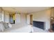 Spacious main bedroom featuring a sliding barn door, a fireplace, and a closet door at 6278 E Euclid Ave, Centennial, CO 80111