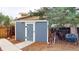 Backyard shed on a mulched lot, offering practical storage and blending well with the home's surroundings at 6278 E Euclid Ave, Centennial, CO 80111
