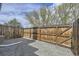 Fenced backyard area with pea gravel, wooden fence, and partial greenery at 12332 Colorado Blvd # 30, Thornton, CO 80241