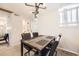 Cozy dining room features a modern light fixture above a wooden table with seating for four at 12332 Colorado Blvd # 30, Thornton, CO 80241