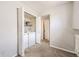 Laundry closet with stacked washer and dryer, shelving, and neutral walls at 12332 Colorado Blvd # 30, Thornton, CO 80241