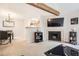 Comfortable living room with a fireplace, seamlessly connected to the dining area at 12332 Colorado Blvd # 30, Thornton, CO 80241