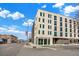 Modern apartment building with clean lines, neutral brick, ample windows, and city views at 603 Inca St # 520, Denver, CO 80204