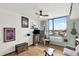 Bright living room with hardwood floors, large window with city view, and charming decor at 603 Inca St # 520, Denver, CO 80204