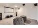Finished basement features a projector, sound system, and comfortable seating at 10698 W 26Th Ave, Lakewood, CO 80215
