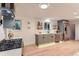 Modern kitchen features stainless steel appliances, sleek gray cabinetry and ample counter space at 10698 W 26Th Ave, Lakewood, CO 80215
