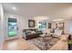 Bright living room with modern decor, a patterned rug, and ample natural light at 10698 W 26Th Ave, Lakewood, CO 80215